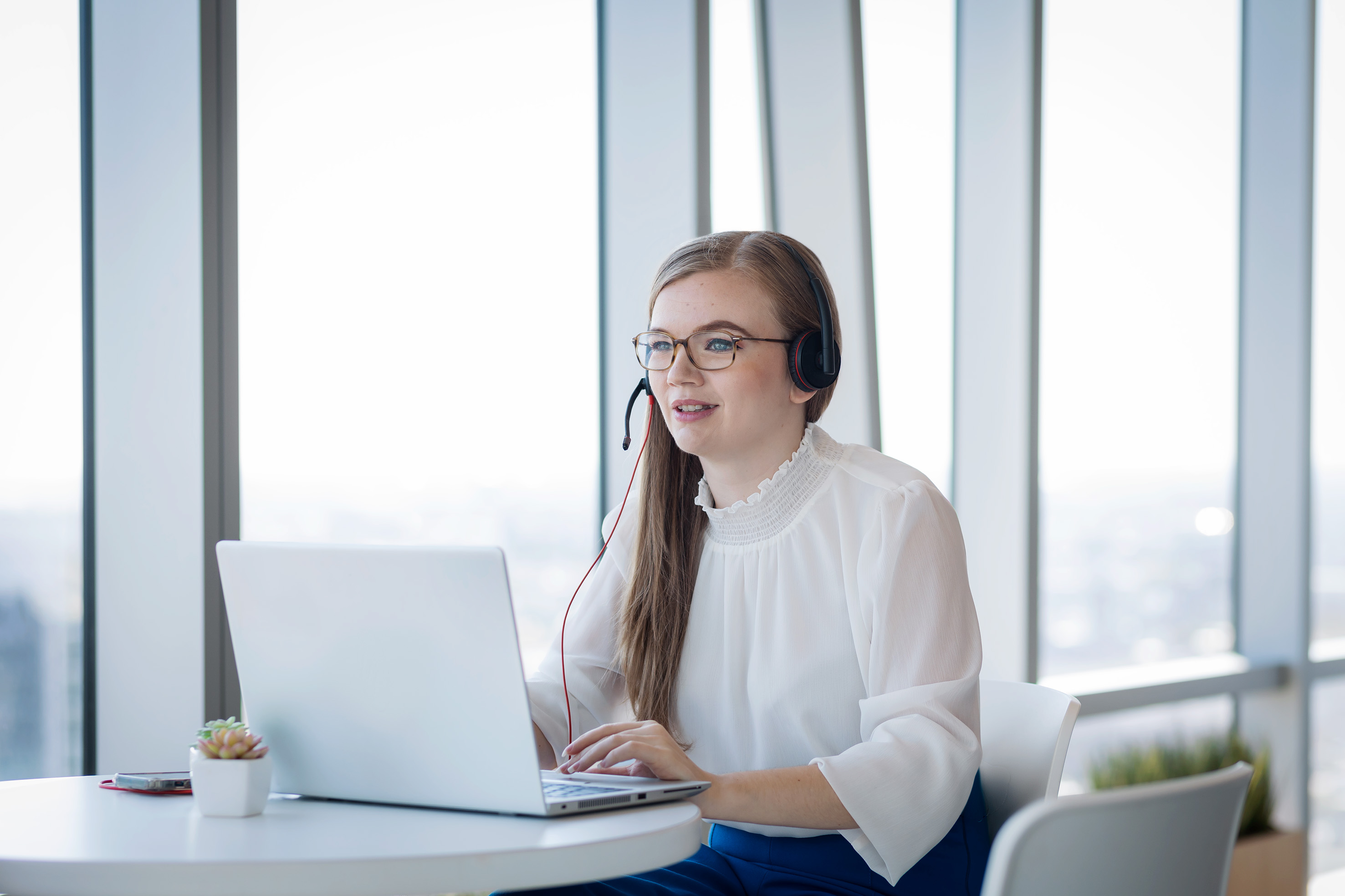 An employee attending an online meeting