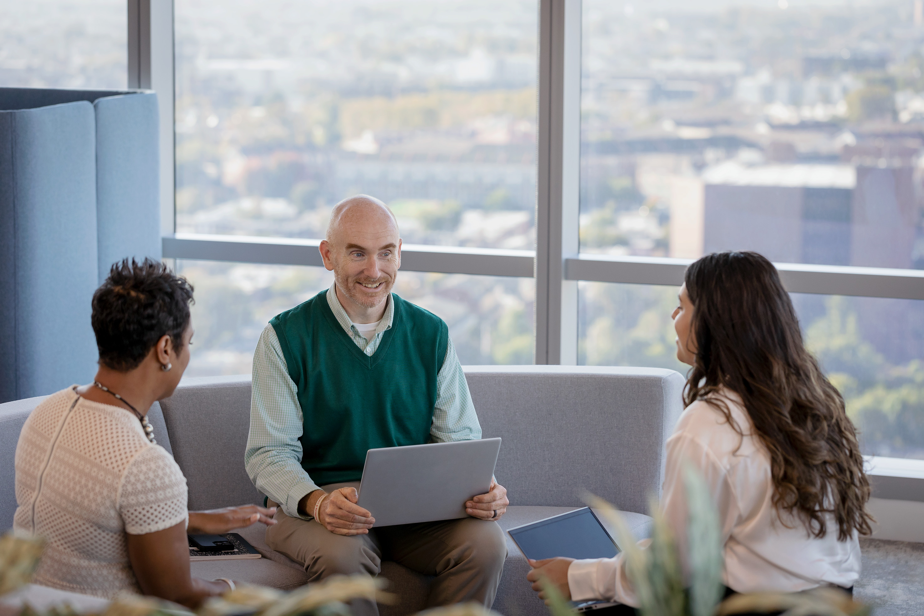 Three employees meeting in the office