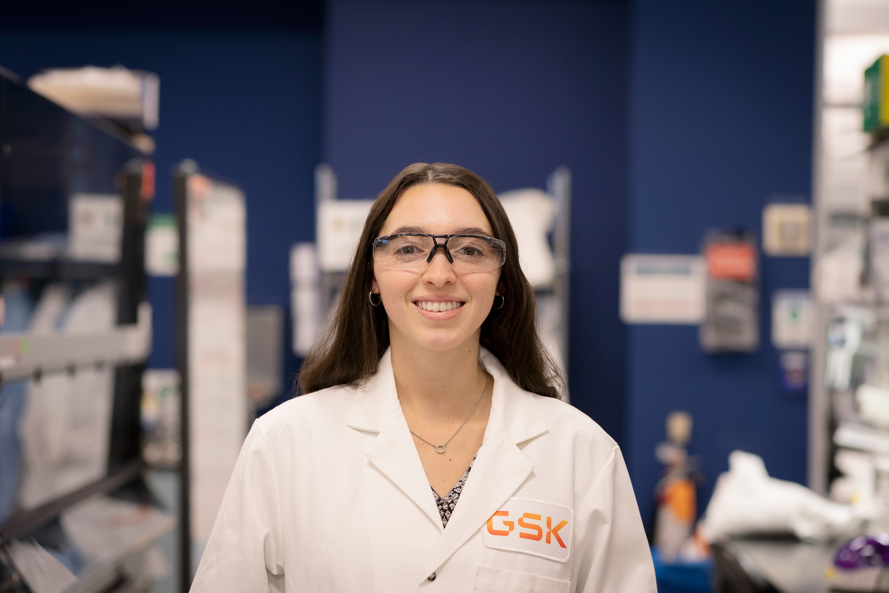 A smiling scientist posing in the lab