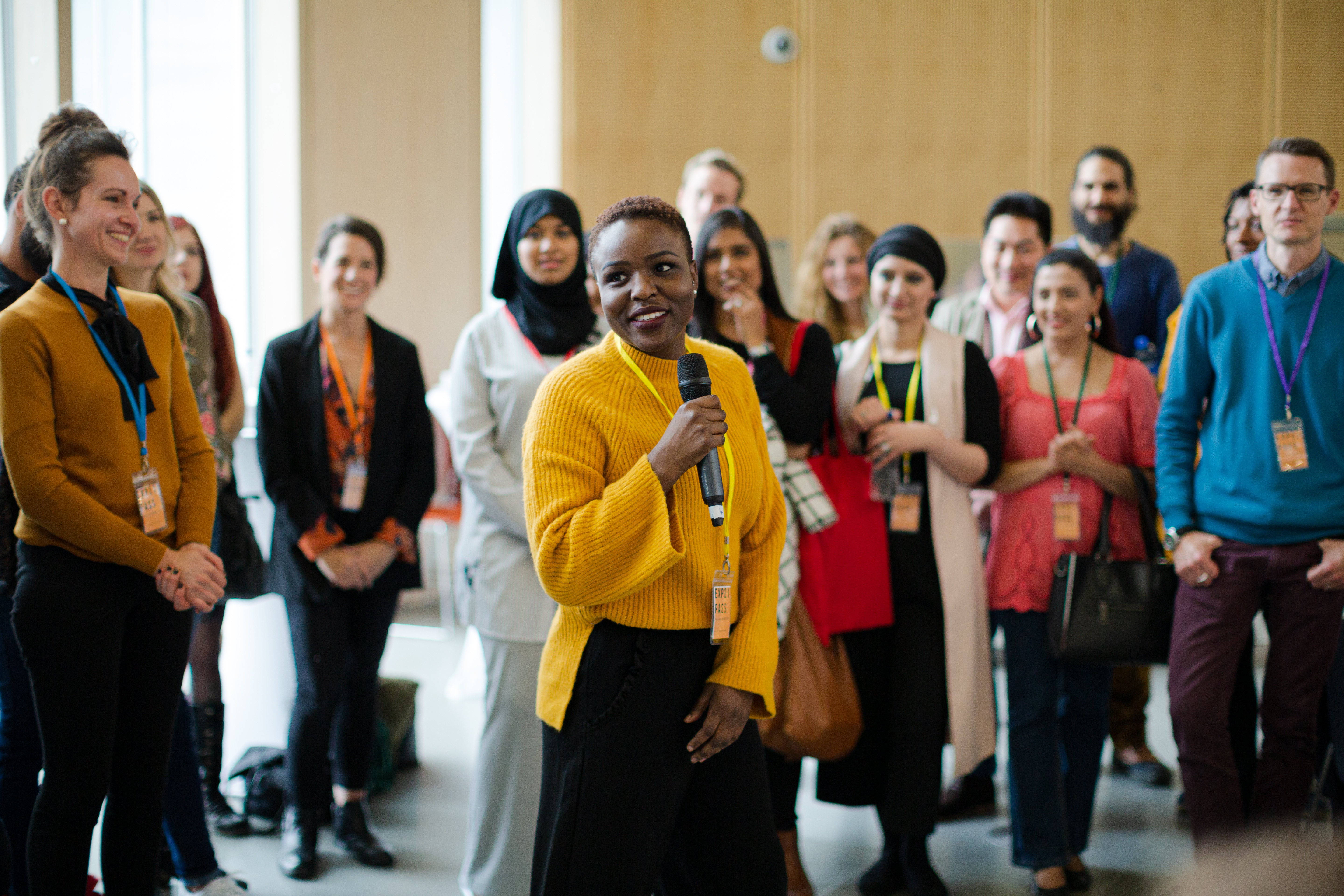 black woman addressing a group of people.