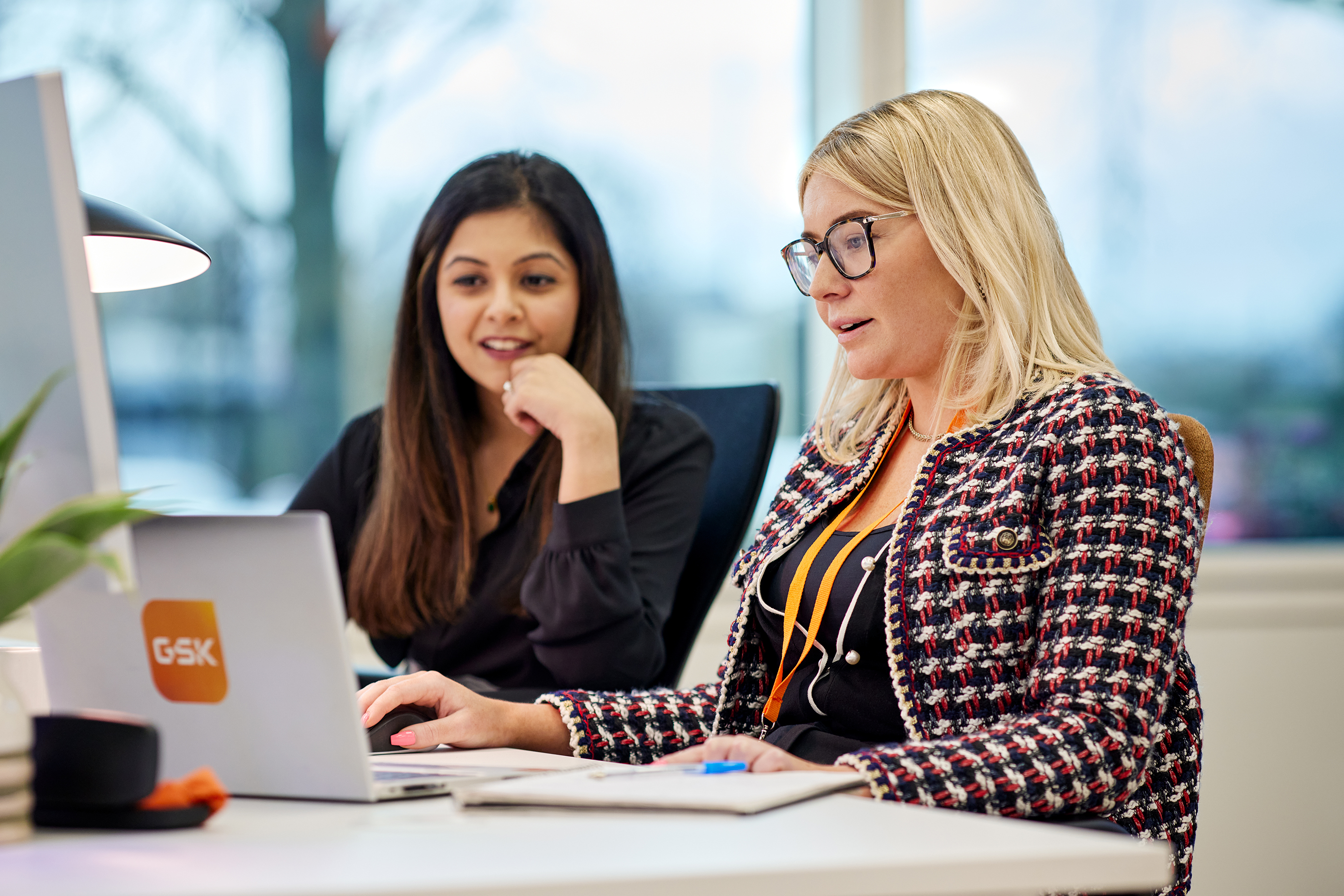 two female employees working in the office 