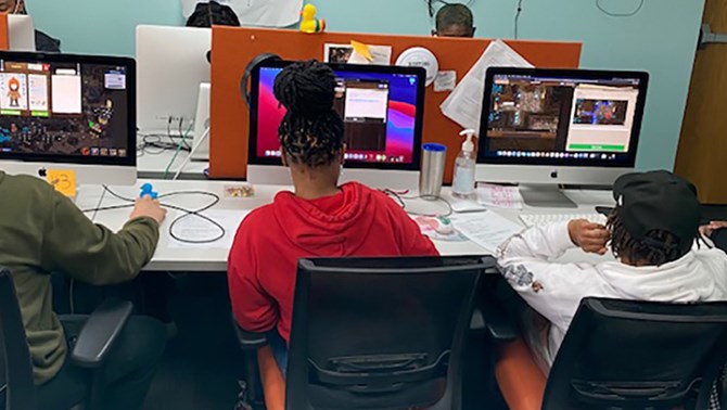 Students working at computers in class