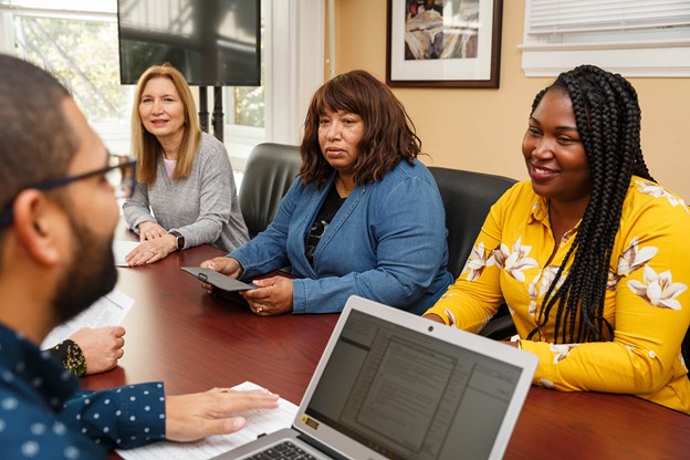 group of employees in a meeting room.