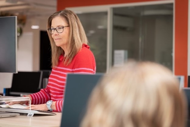 women looking at computer screen 