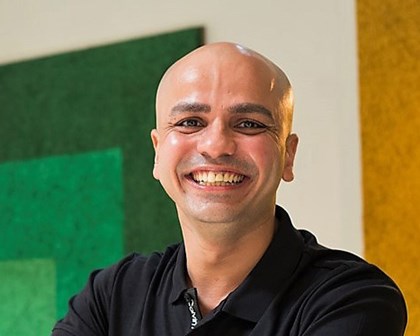 Jigar smiling in a black shirt as the headline to the leading the way to inclusion story 