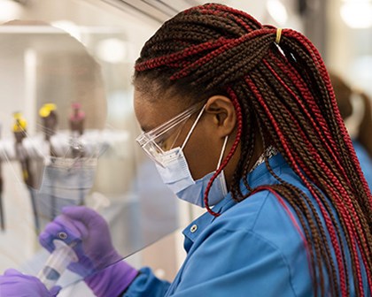 Scientist with syringe