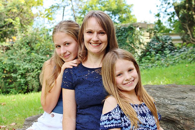 Beth outside with her two daughters