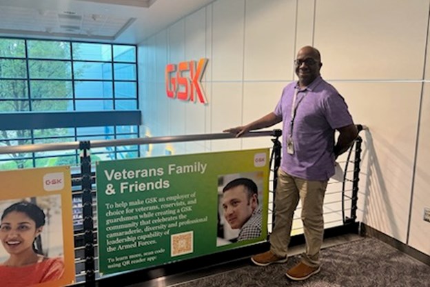 Bullock standing in front of the ERG banner 