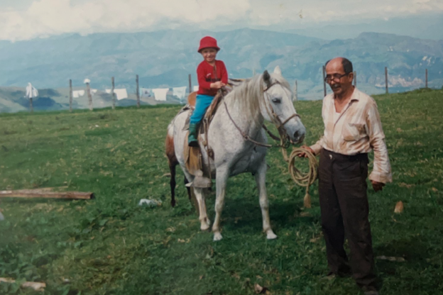 Andrea on a farm riding a horse