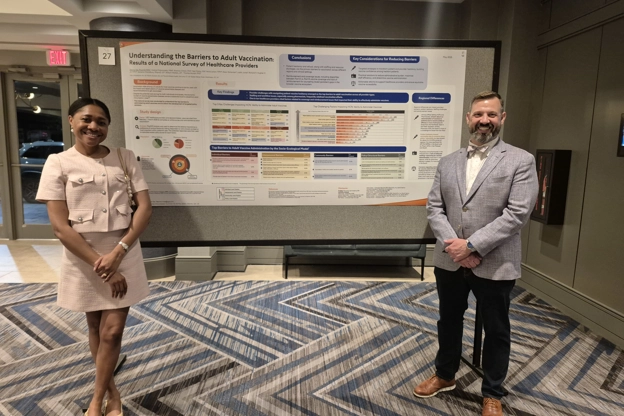 Two colleagues presenting data
