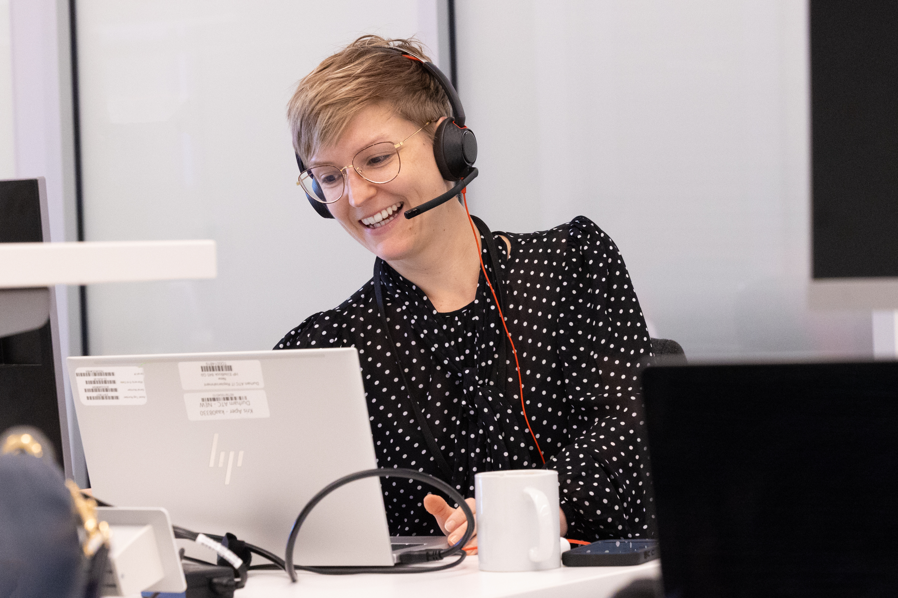 A woman attending an online meeting