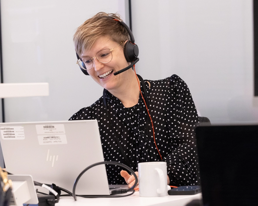 A woman attending an online meeting