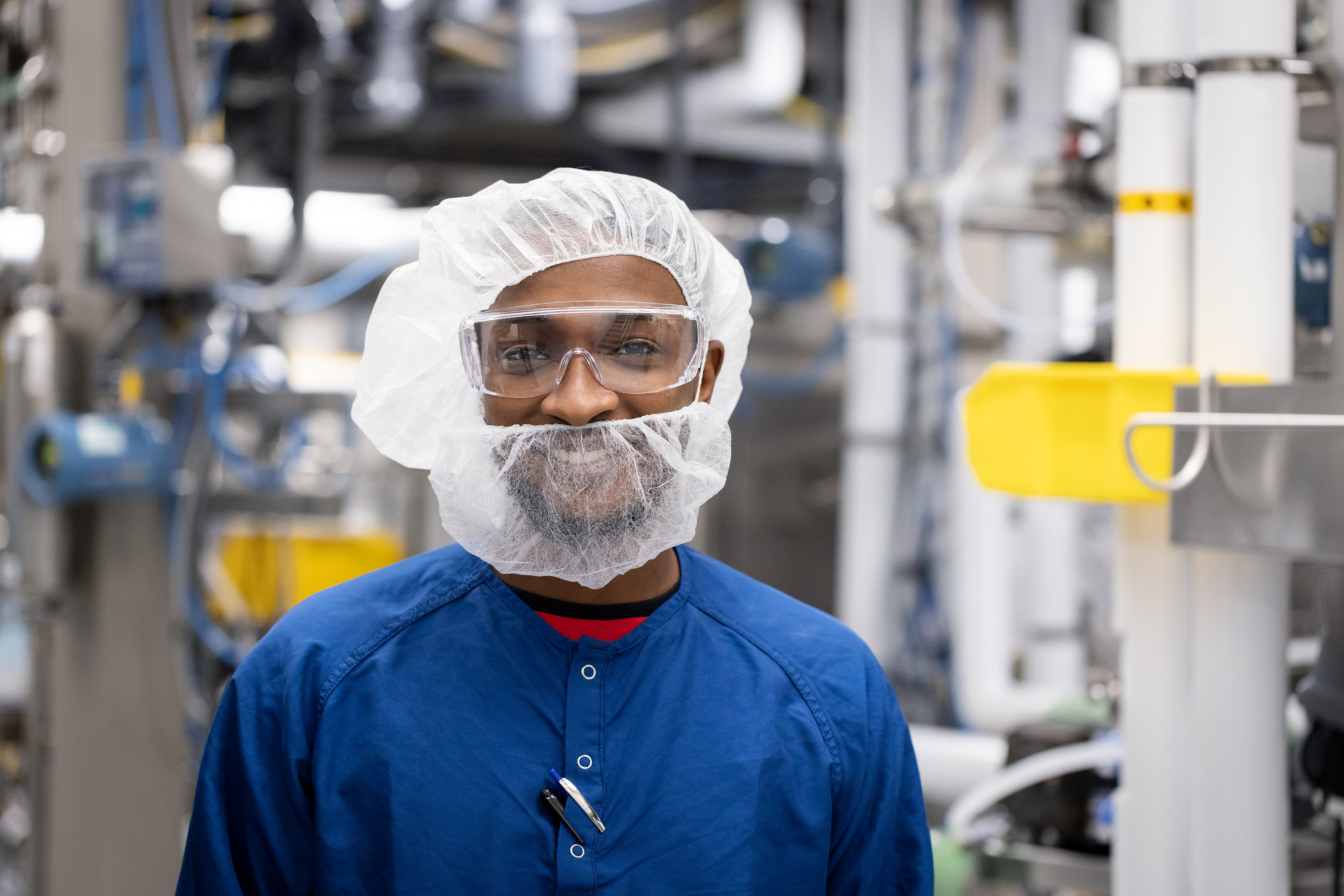 A smiling scientist posing in the lab