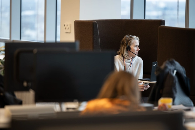 An employee attending an online meeting