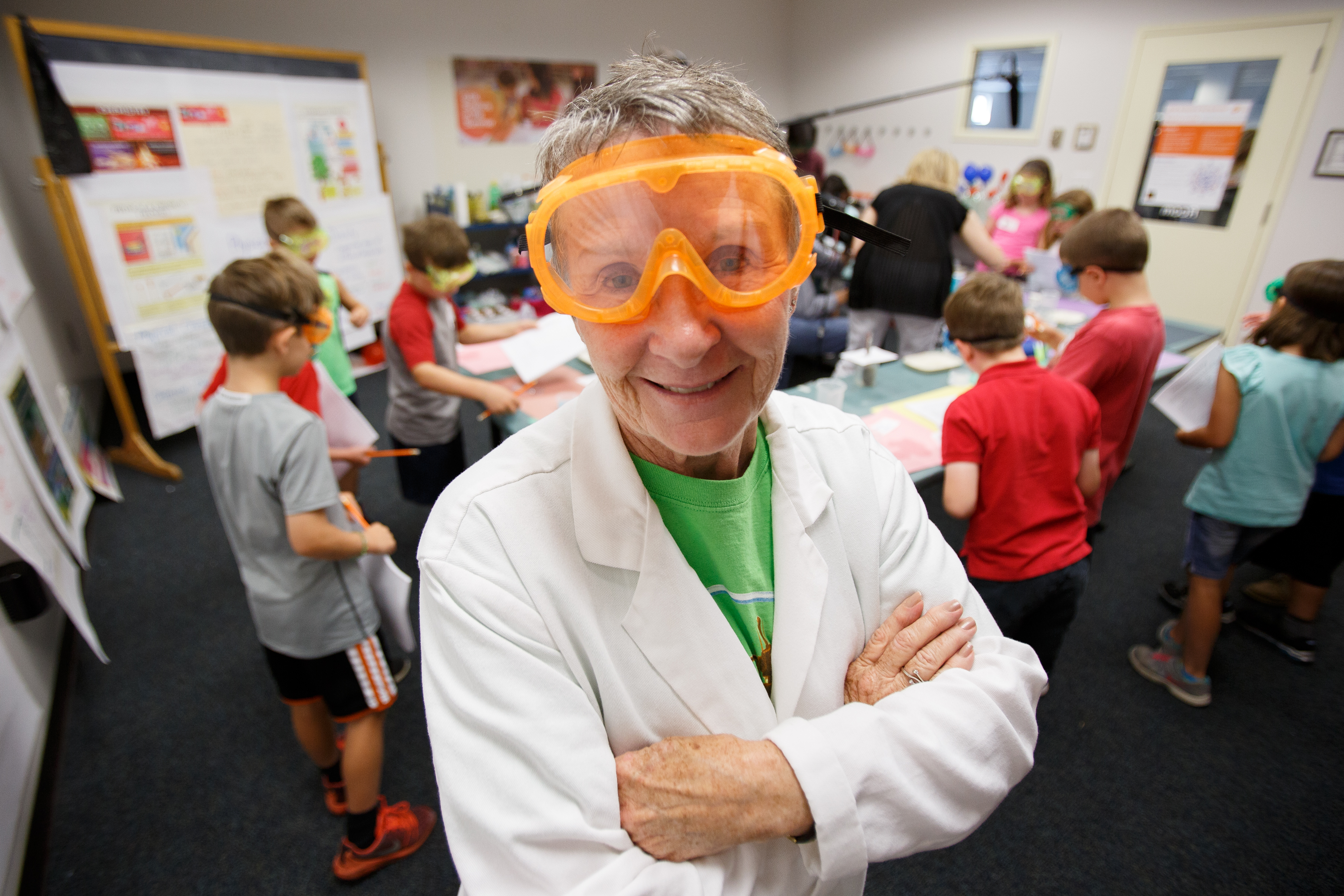 female scientist with orange goggles 