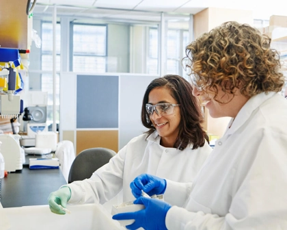 Two scientists sorting samples