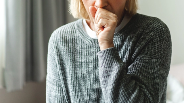 a woman coughing