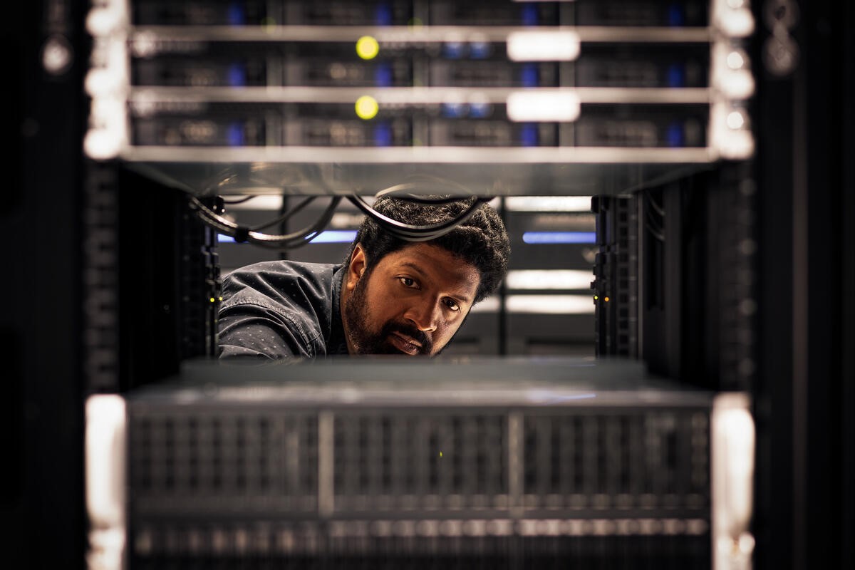 a man working with a computer.