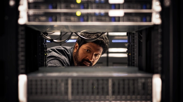 a man working with a computer.