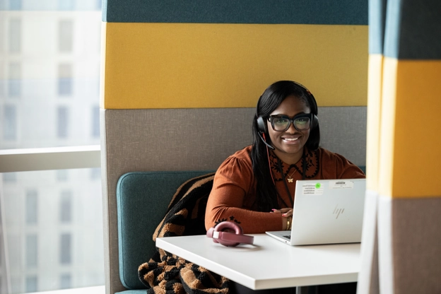 A smiling office employee looking towards the camera