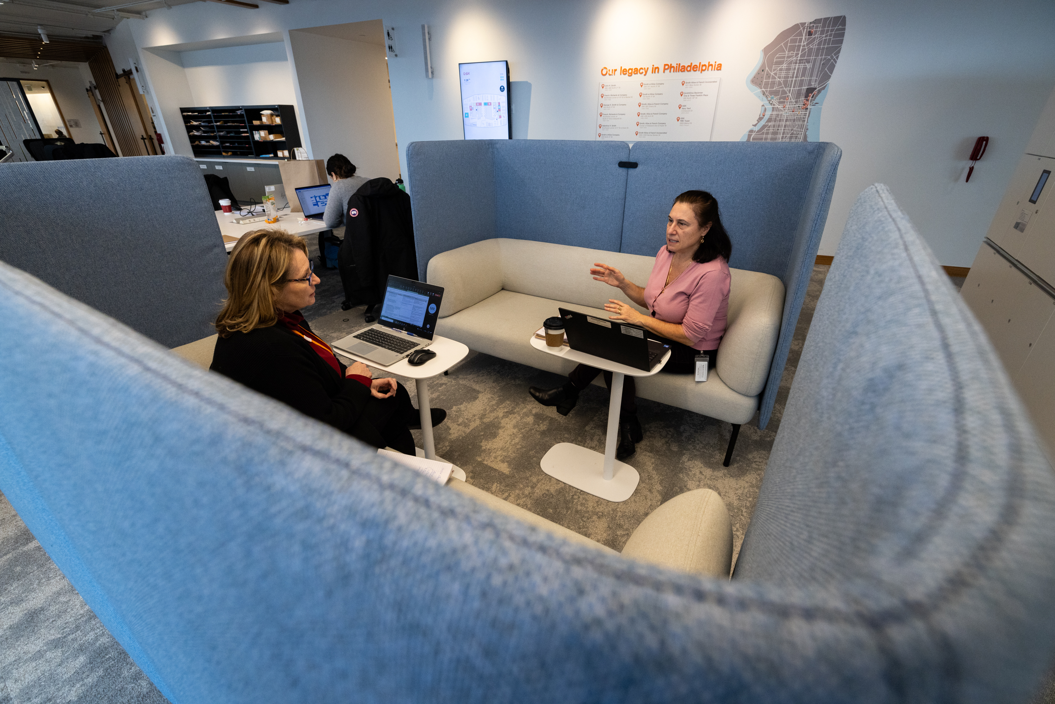 Two employees discussing work in the office