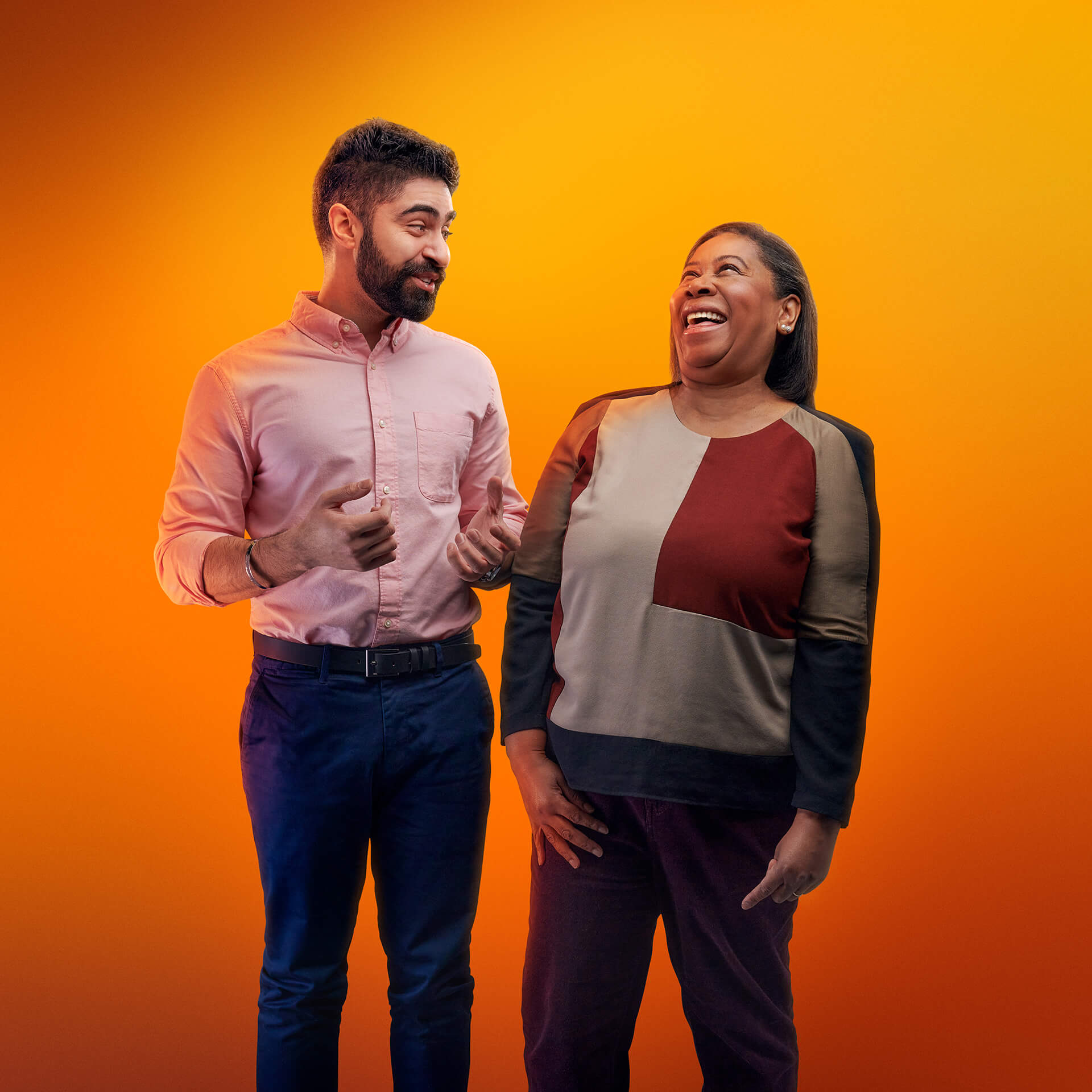 two employees laughing 