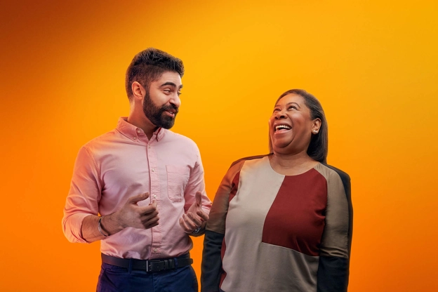 two employees laughing