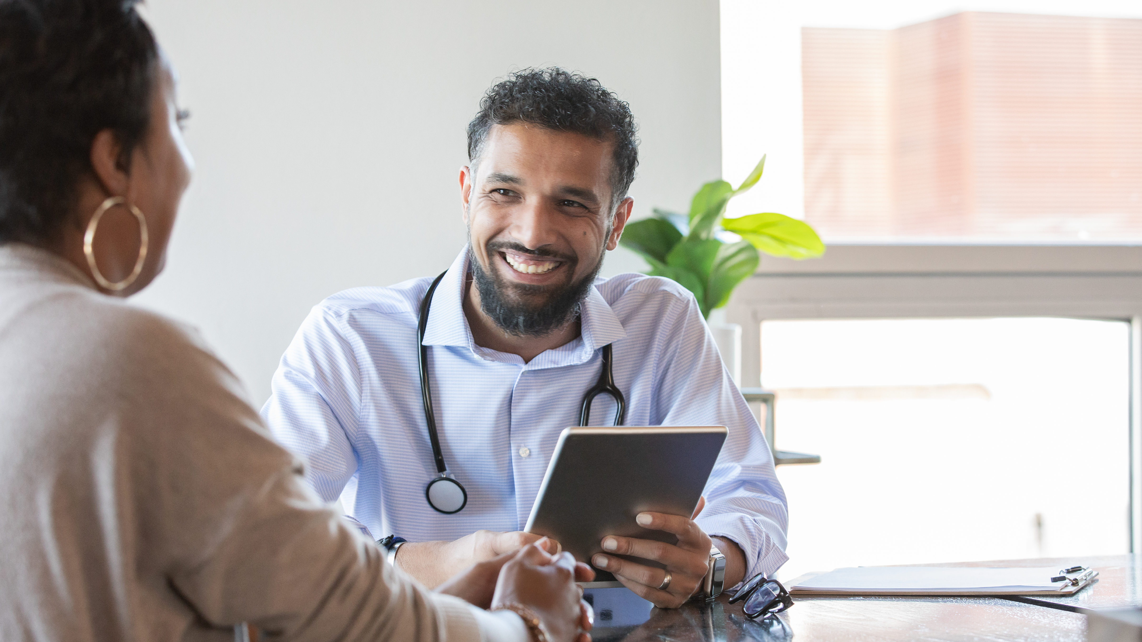 Doctor speaking to patient