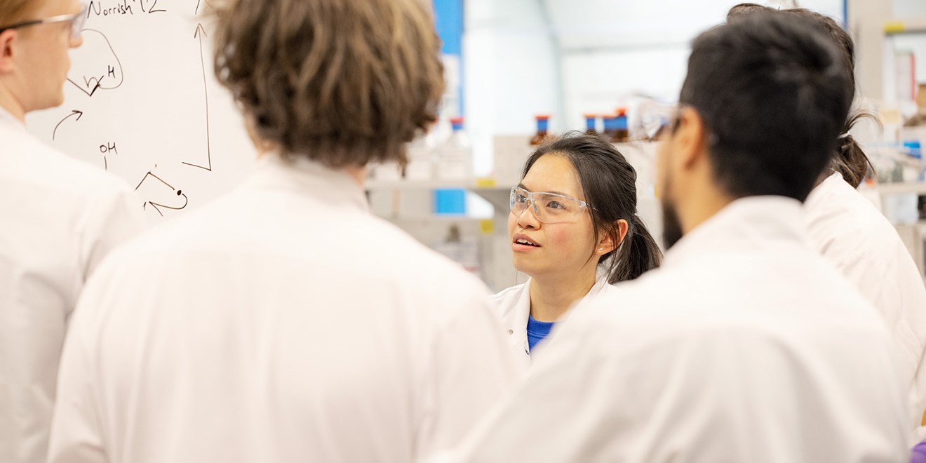 Scientists in a lab having a discussion 