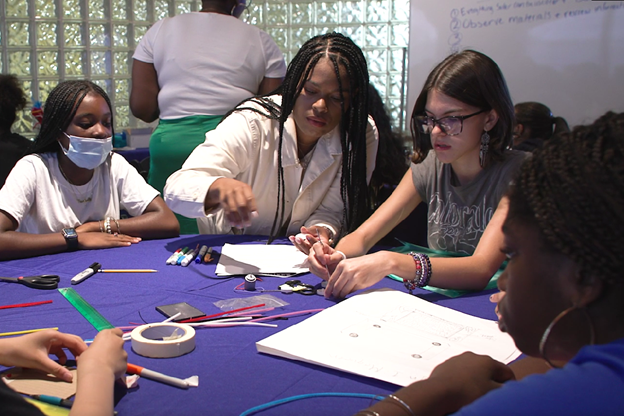 group of people working on science project.