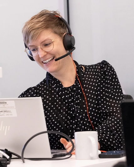A woman attending an online meeting