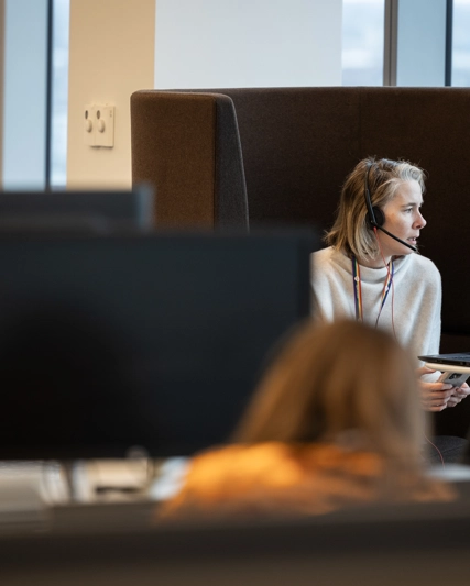 An employee attending an online meeting