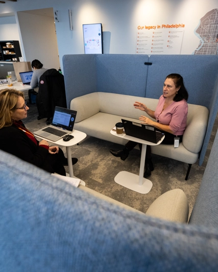 Two employees discussing work in the office