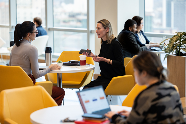 Two employees discussing work in the office