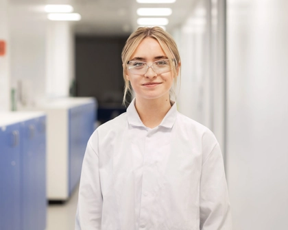 Female scientist standing in the hallway in the lab