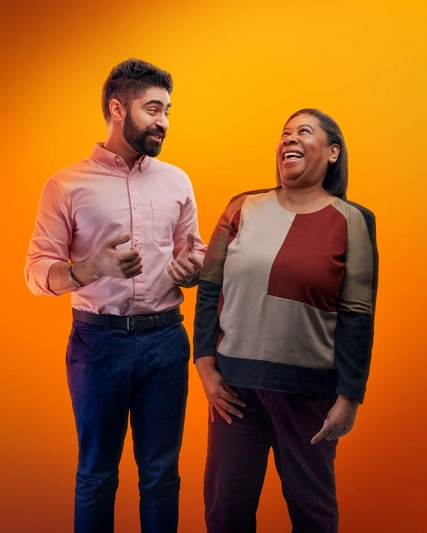 two employees laughing